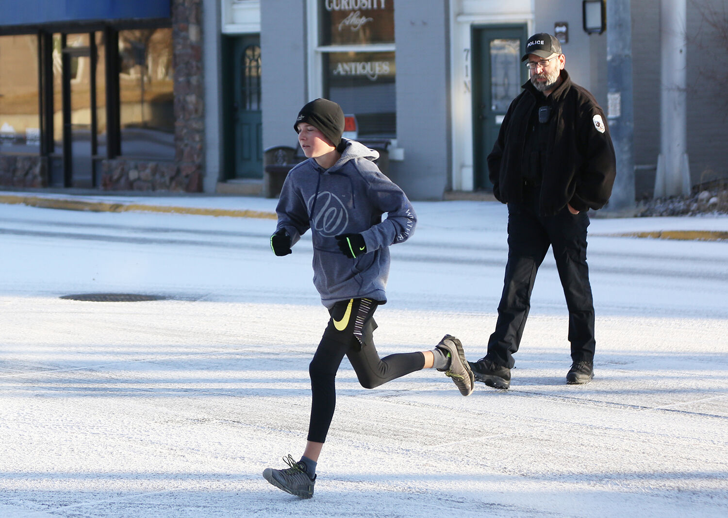 Zack Freise runs across the intersection